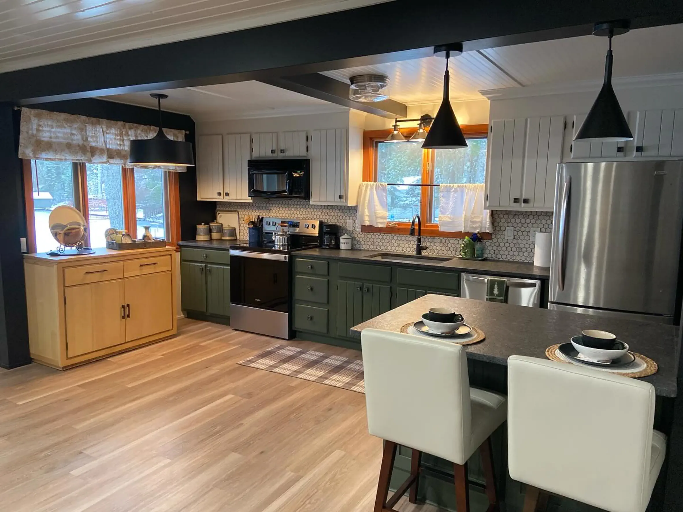 Kitchen remodel Kitchen remodel with green and white cabinets, tile backsplash